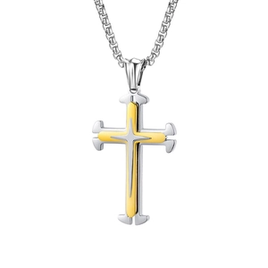 Detailed view of dual-layer stainless steel cross pendant with gold and silver finishes