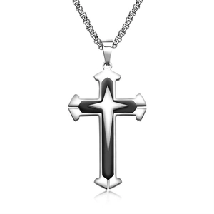 Detailed close-up of a three-layer stainless steel cross pendant with black enamel inlay