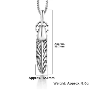Detail view of retro silver feather pendant with 55.7mm length and 12.1mm width dimensions