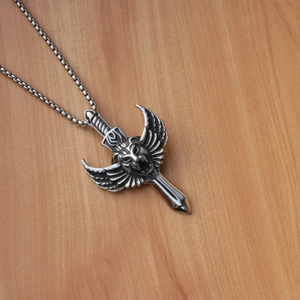 Macro detail of gothic lion head relief with wings on sword pendant necklace