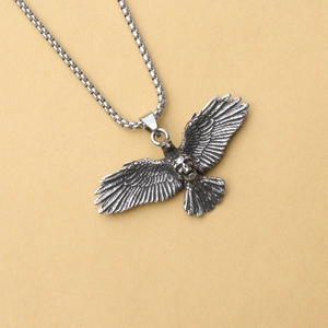 Vintage stainless steel falcon necklace with eagle wings and skull design for men and women