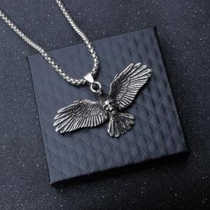 Gothic falcon skull necklace in antique silver finish with detailed eagle wings