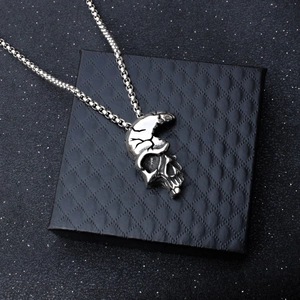 Vintage half-face skull pendant in antiqued silver stainless steel on a black box chain