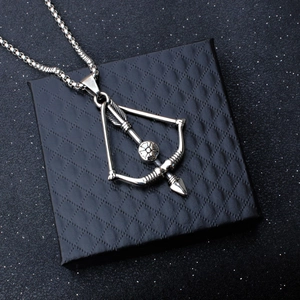 Titanium steel bow and arrow pendant necklace displayed on a black textured jewelry box