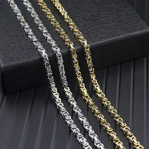 Macro detail of men's Byzantine titanium steel bracelets in silver and gold-tone finish