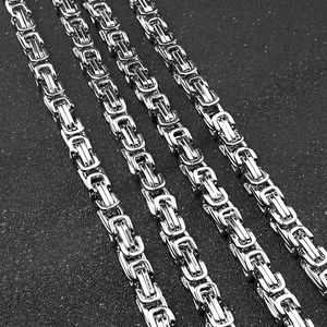 Detailed macro view of silver Byzantine steel chains showing interlocking link structure