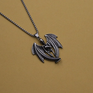 Gothic punk necklace featuring a detailed skeleton pendant with large bat wings on a chain