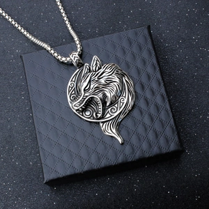 Detail of Viking wolf head pendant on black jewelry box with stainless steel chain