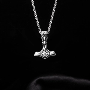 Silver Mjolnir Thor Hammer necklace with Viking runes and skull on black silk background