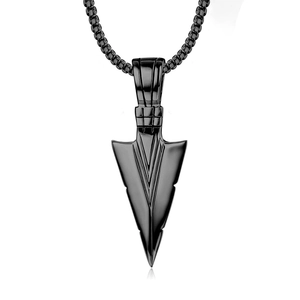 Macro detail of industrial black arrowhead pendant on thick round link chain