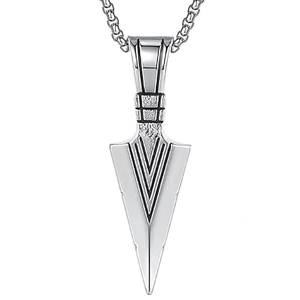 Detail of masculine arrow pendant featuring textured top and geometric punk pattern