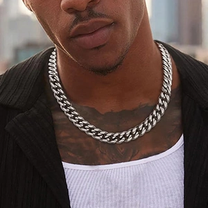Detailed close-up of a heavy silver stainless steel Cuban link chain necklace for men