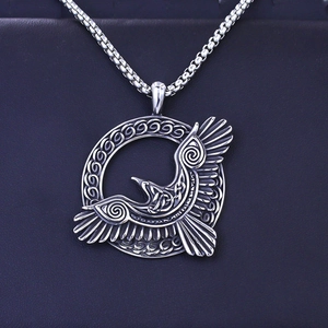 Detailed macro view of the Viking eagle pendant with intricate Celtic knot patterns