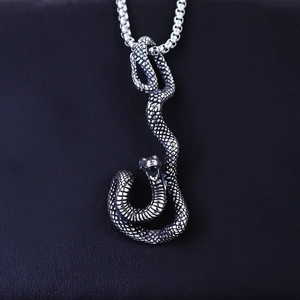 Punk style stainless steel mamba snake pendant necklace with detailed scales on black leather