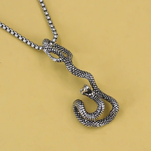 Punk style stainless steel snake pendant necklace with detailed scales on a box chain