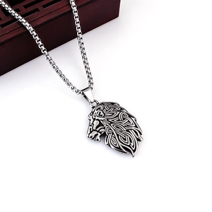 Close-up of vintage lion head pendant with Celtic patterns and sturdy square box chain
