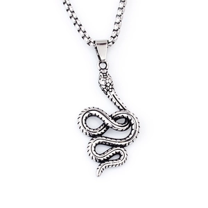 Detailed close-up of retro stainless steel snake pendant with intricate scale texture