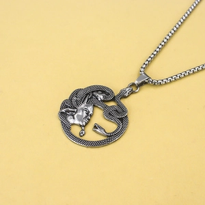 Close-up of retro stainless steel Medusa snake pendant necklace with square pearl chain
