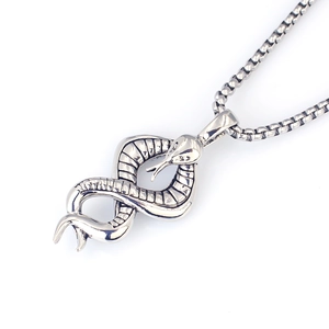 Detailed view of punk snake pendant with scales on a vintage steel square pearl chain