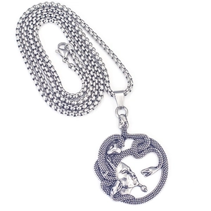 Close-up of Medusa head pendant with detailed snakes on a silver box chain necklace