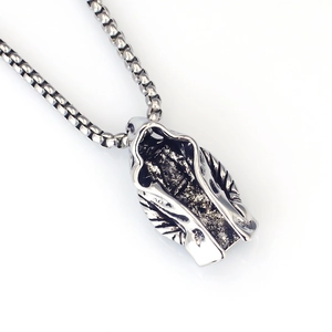 Detail of gothic assassin cloak pendant on a durable stainless steel box chain