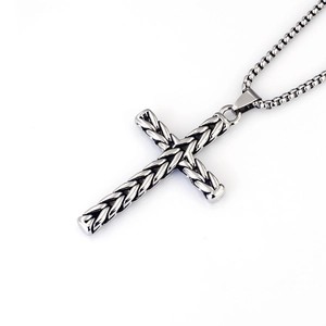 Close-up of vintage stainless steel cross necklace with twisted rope texture and box chain