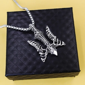 Vintage stainless steel trident pendant necklace with box chain on jewelry box