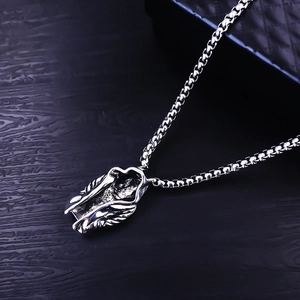 Macro shot of silver gothic reaper cloak pendant with a classic stainless steel box chain