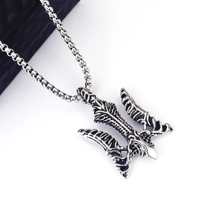 Close-up of vintage steel Viking trident anchor pendant with detailed box chain