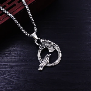 Vintage stainless steel necklace featuring a double raven ring pendant on a pearl box chain