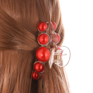 Elegant red pearl hair claw clip on brown hair for women stylish updo styling accessory