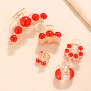 Set of five elegant red pearl hair claws in various sizes with gold metallic springs