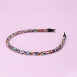 Detailed macro view of colorful handmade beaded thin headband with multi-colored micro beads