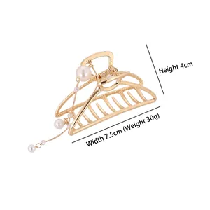 Pince à cheveux élégante en métal doré avec pampille en perles, hauteur 4cm et largeur 7,5cm