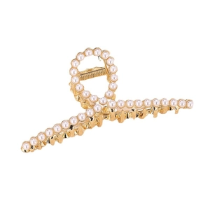 Elegant gold metal hair claw clip with pearls and rhinestones on a white background