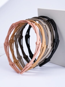 Detail of multi-color folding headbands with non-slip teeth and matte finish