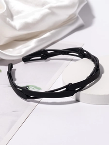 Foldable matte black headband with telescopic hinge design on elegant white silk base