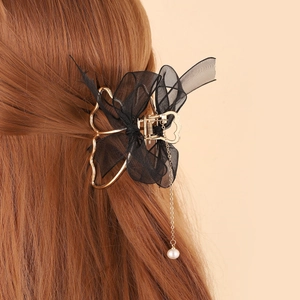 Elegant gold hair claw clip with black mesh bow and dangling pearl tassel detail