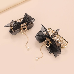 Elegant gold metal hair claw clips with black mesh bows and pearl tassel pendants