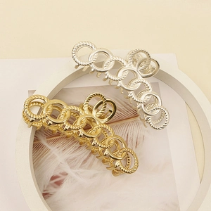 Fashionable hollow metal geometric hair claws in polished gold and matte silver finish