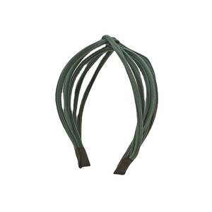 Minimalist dark green knitted striped cross-knot headband for women on a white background