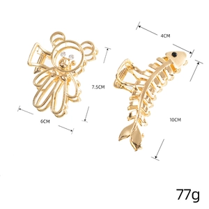 Set of two gold metal hollow bear and fishbone hair claws with rhinestone accents