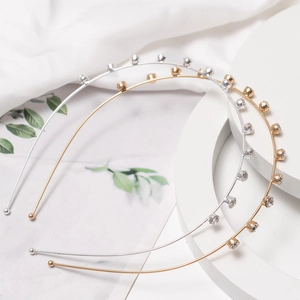 Elegant gold and silver metal headbands featuring sparkling rhinestones on a white background