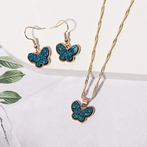 Fashionable butterfly jewelry set with blue glitter pendant necklace and drop earrings
