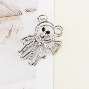 Elegant bear shaped silver metal hair claw clip with black bead eyes on white background
