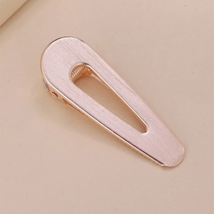 Minimalist rose gold brushed metal hair clip in a sleek teardrop hollow design