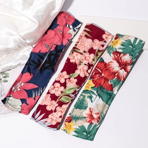 Floral print deft bun hair makers in navy, burgundy, and white on silk fabric