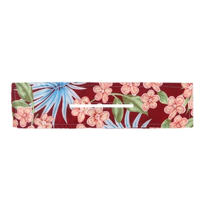 Detailed view of red floral Deft Bun hair tool with tropical print and center slot