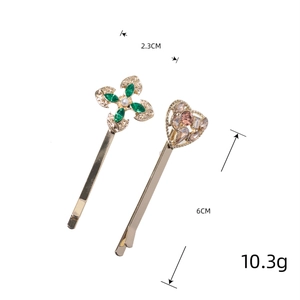 Elegant gold metal hair clips set with green clover and pink heart rhinestone charms