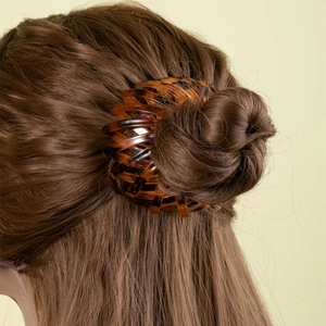 Bird nest hair clip with tortoise shell pattern for bun styling and ponytails